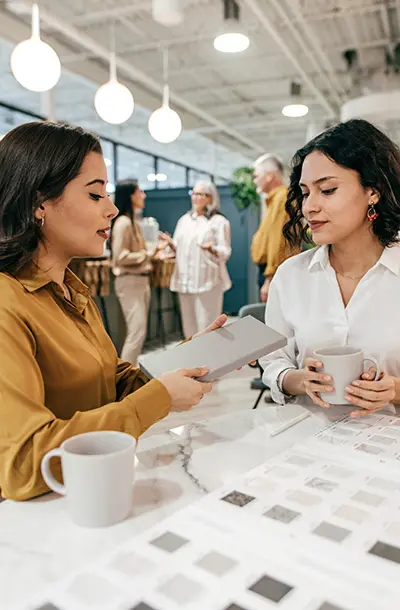 Designer and customer reviewing samples