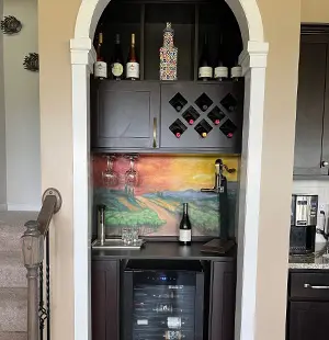 Dry bar cabinetry in Mocha, Mission doors, wine rack, beverage cooler.