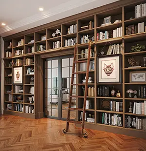 Custom floor-to-ceiling built-in bookcase with a sliding ladder in a home library featuring wood cabinetry, parquet flooring, and French doors leading to an adjacent room