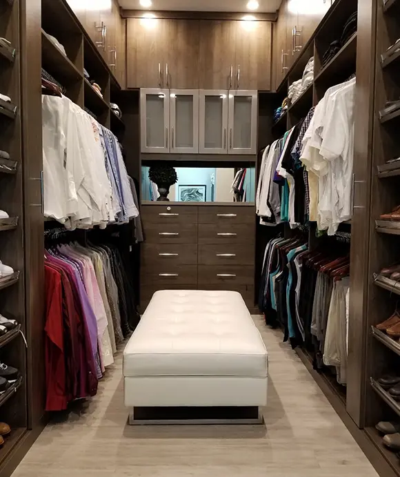Closet Factory FTL walk in dark woodgrain cabinetry with LED lighting and custom drawers