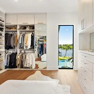 Custom walk in closet with double hanging rods designed by Closet Factory FTL