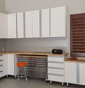 Built in garage cabinetry with slatwall organizer