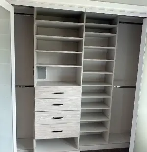 Custom reach in closet in light woodgrain melamine