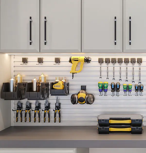 Slatwall organizers for tools in garage
