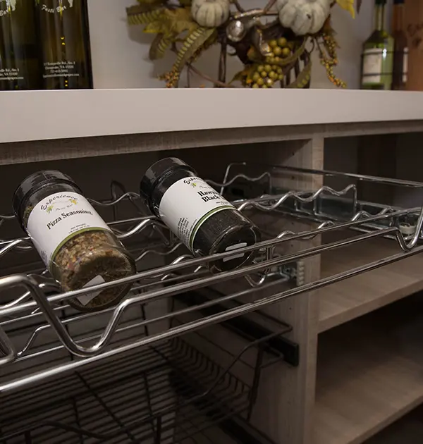 Metal wine racks and organizers in custom pantry