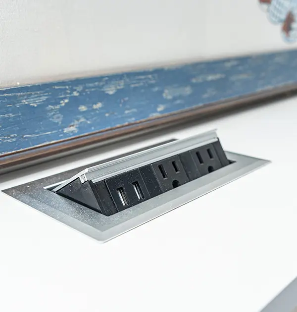 Concealed charging ports in wall bed