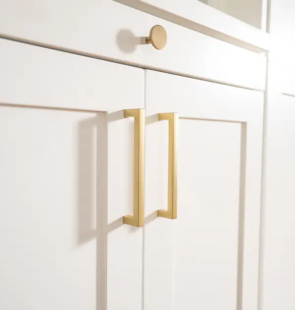 Gold hardware on wall bed cabinets