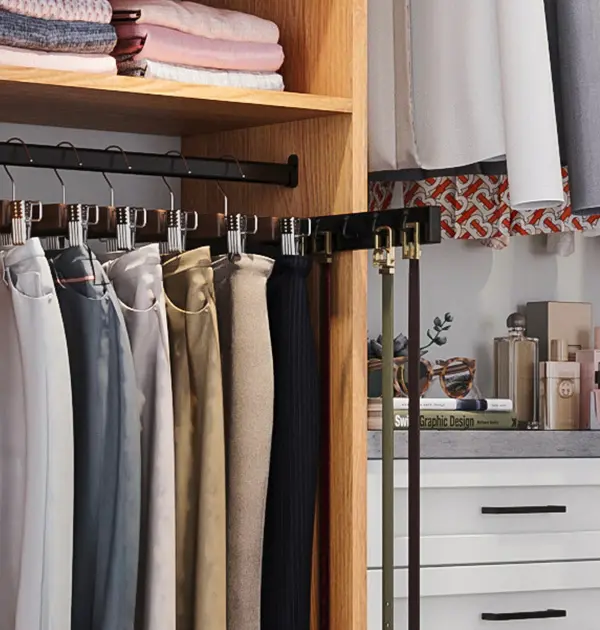 Belt rack and pant hangers in light wood wardrobe cabinet
