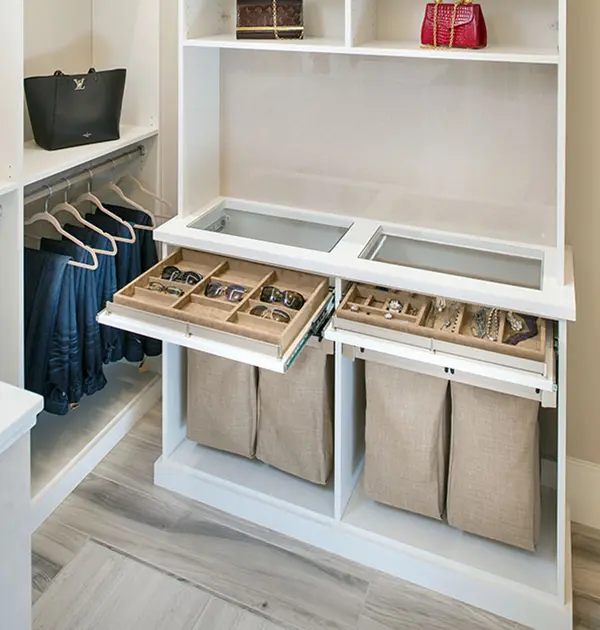 Suede trays for sunglasses and jewelry. Fabric hamper bags below.