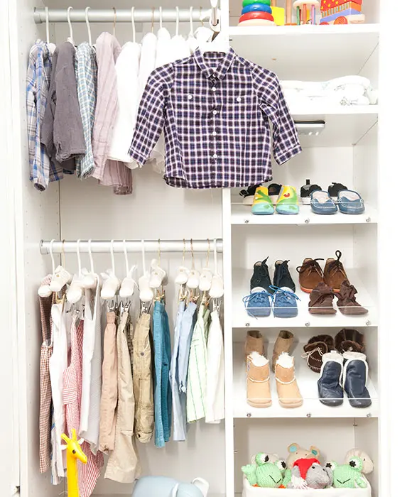 Childrens closet with adjustable shelving and double hanging rods