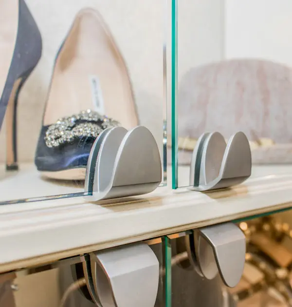 Glass cabinet door with modern metal hinge hardware.