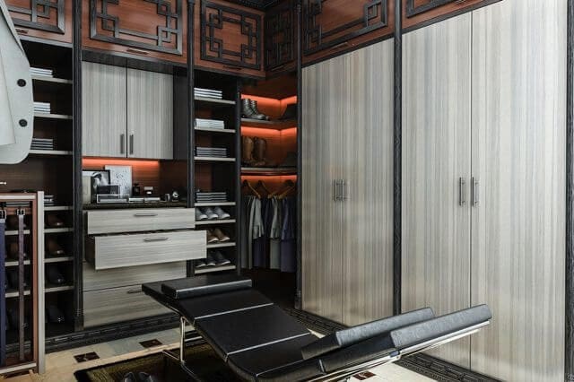 asian influence custom walkin closet with white woodgrain doors
