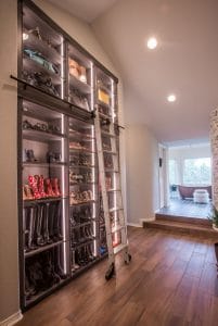 A well-lit shoe closet using LED strip lights and pot lights