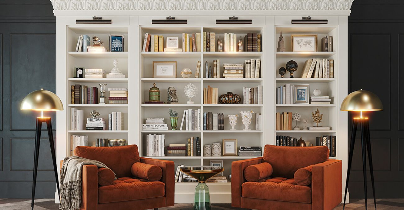 Custom built-in book shelving with decorative crown molding and library lighting