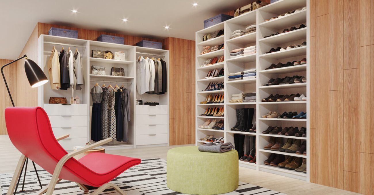 Custom closet system in Almond melamine with full-height shoe shelving, double-hang wardrobe rods, and integrated drawer towers.