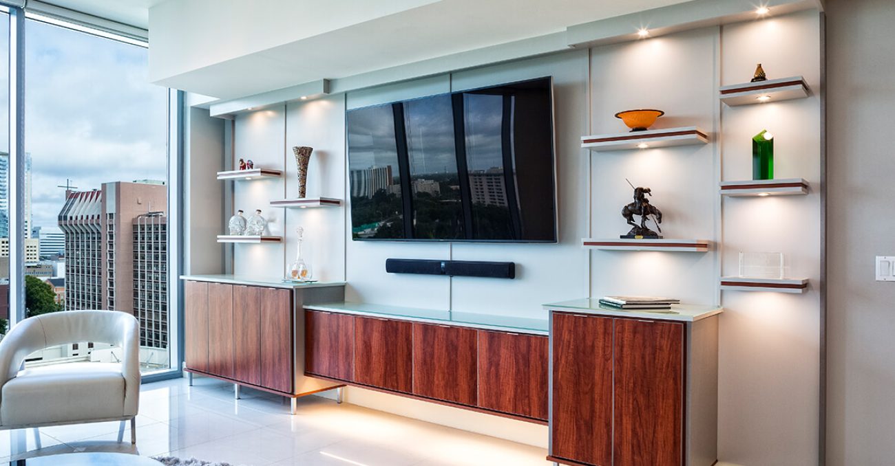 Sleek entertainment center with floating shelves with underlighting