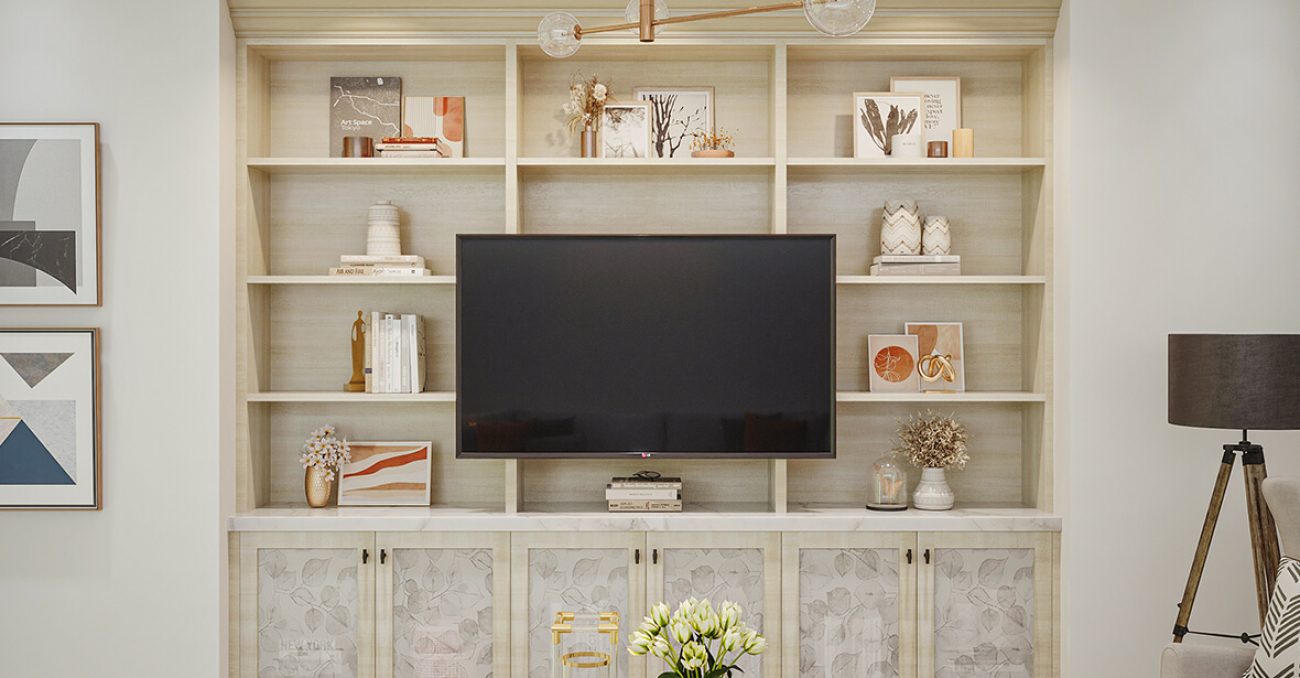 Built-in shelving around TV with decorative cabinet door fronts