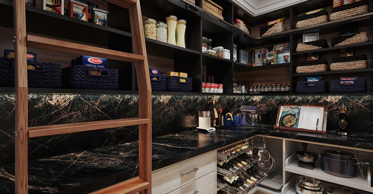 Pantry with black cabinetry, marble-look counters, woven baskets, and a wooden ladder for high shelf access.