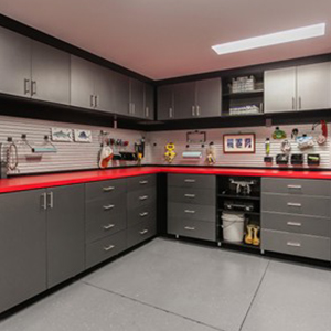 Custom garage design with red counter top and slate grey cabinetry
