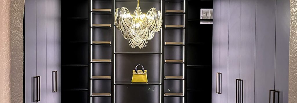 Luxurious black walk-in closet with sleek cabinetry