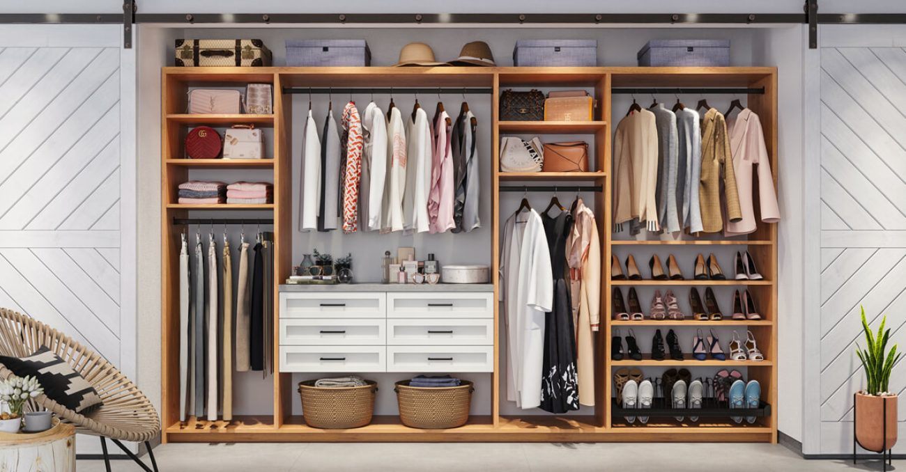 Dual-tone reach-in closet system in Tea for Two with White Chocolate drawers with black hardware. Featuring pull-out pant rack, adjustable shelving, and angled shoe shelves.