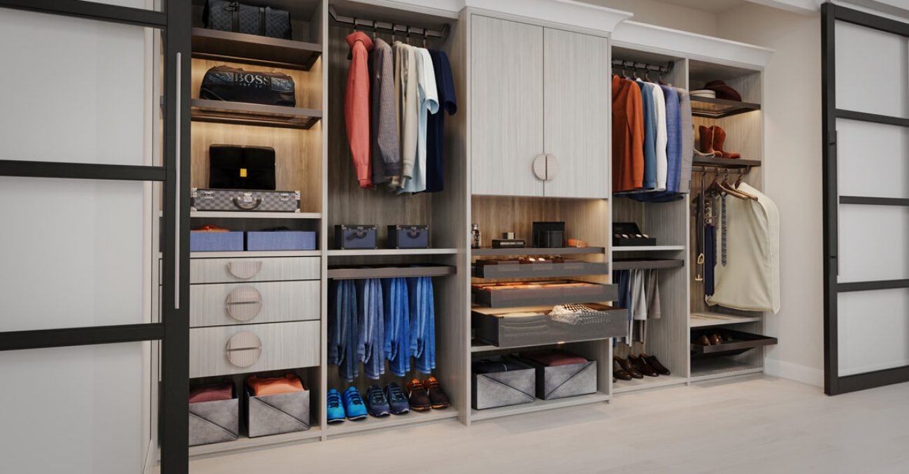 Custom reach-in closet with pant hangers, custom cabinets and drawers
