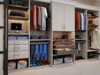 Custom reach-in closet with pant hangers, custom cabinets and drawers