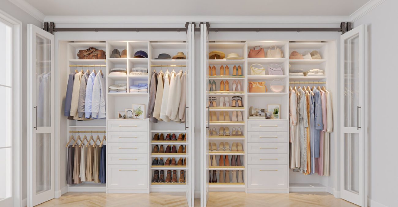 Double hanging, open shelves, and angled shoe racks bring structure to this symmetrical reach-in design with two built-in drawer towers and brass hardware accents.