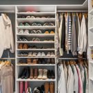 Custom closet layout design with baskets and white cabinets