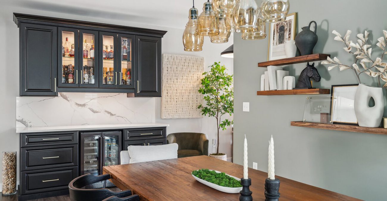 Wet bar with glass front cabinets for bottle storage