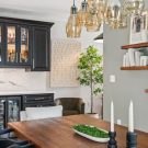 Wet bar with glass front cabinets for bottle storage
