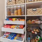 Open wire baskets for produce and breads, keeping everyday items accessible without visual clutter.