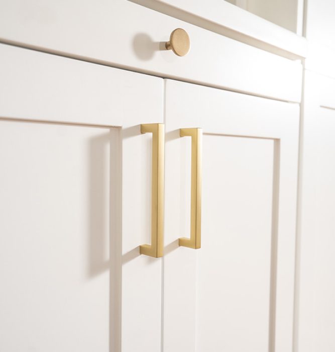 Gold hardware on wall bed cabinets