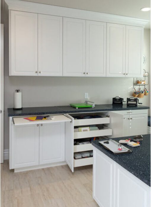 Craft room with pull out folding station and craft organizers