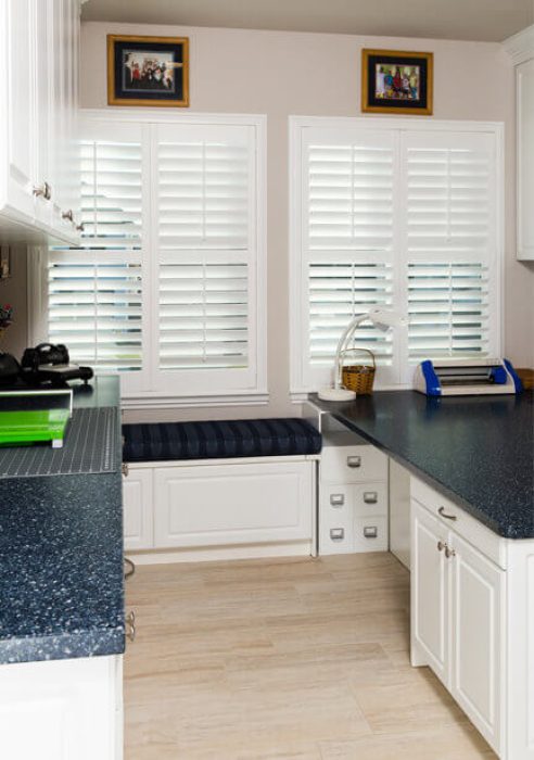 Custom craft room with window bench