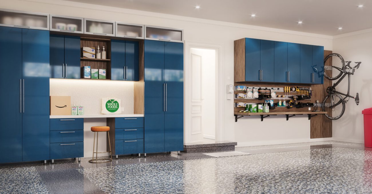 Custom garage cabinetry with polyaspartic flooring and high-gloss blue cabinetry