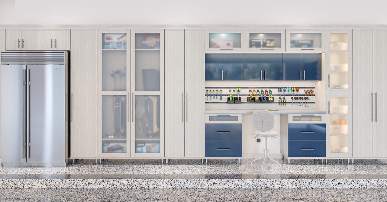 Custom garage design with high-gloss blue cabinets, frosted glass doors, and a slat wall organizer