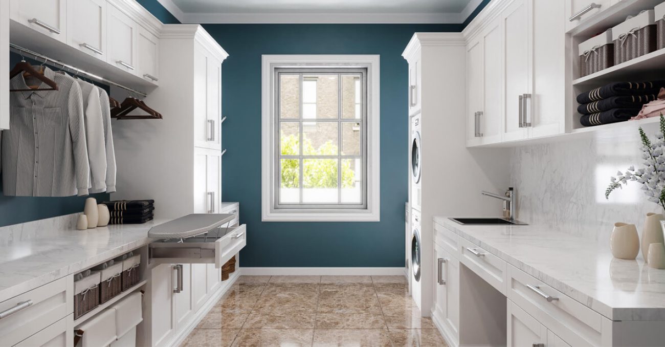 Custom laundry room with pull-out ironing board and laundry sink