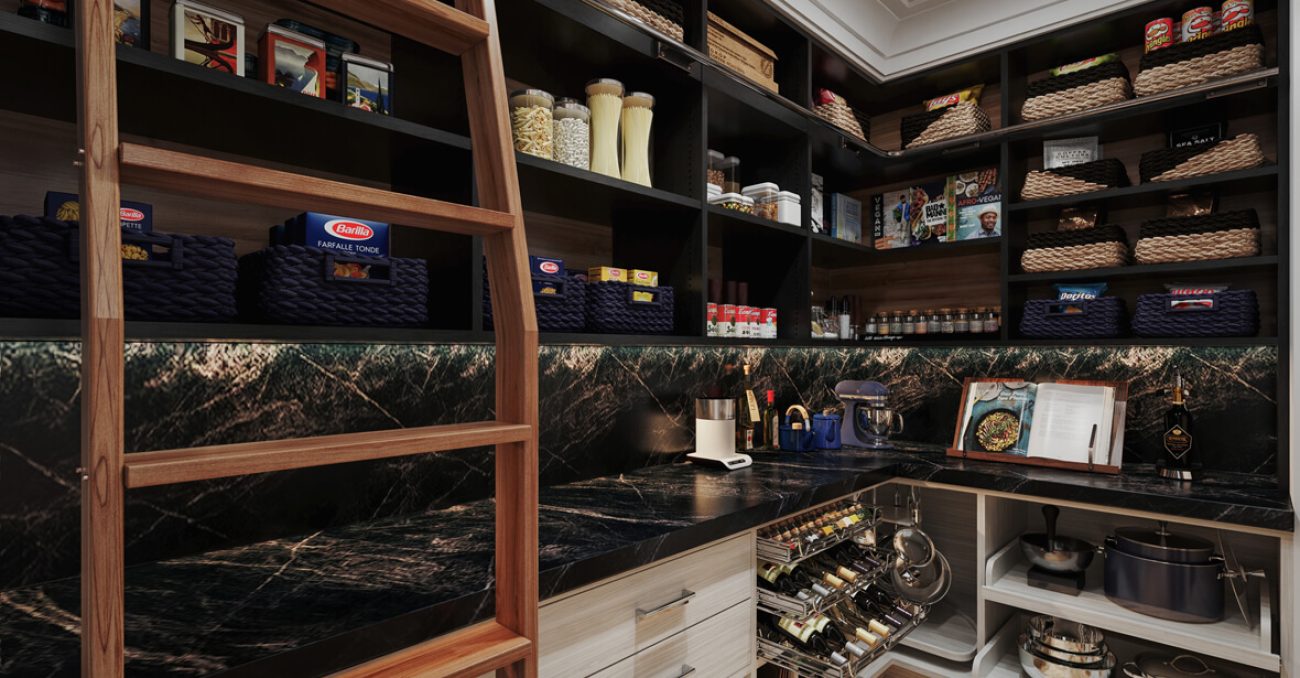 Upscale pantry with black cabinetry, integrated ladder, deep green stone countertops, organized baskets, and metal pull-out storage for wine and cookware.