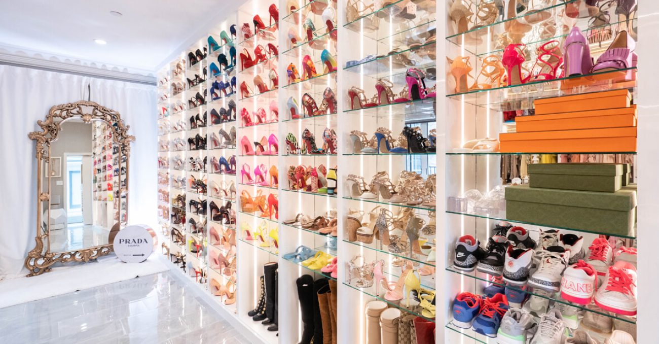 Boutique-style shoe closet with glass shelves