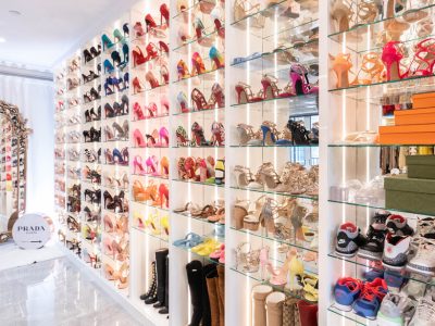 Boutique-style shoe closet with glass shelves