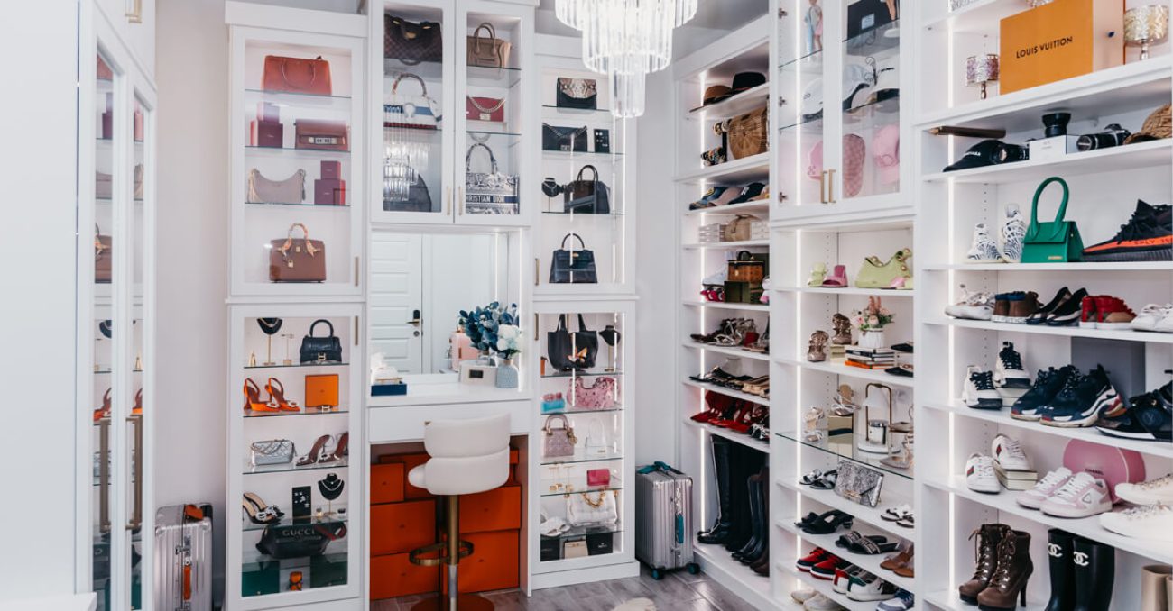Shoe closet with built-in vanity and glass door fronts