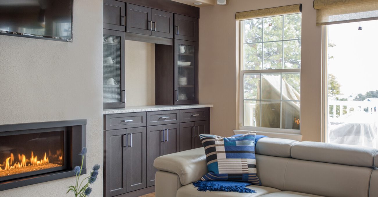 Dark wood built-in cabinetry with upper and lower storage