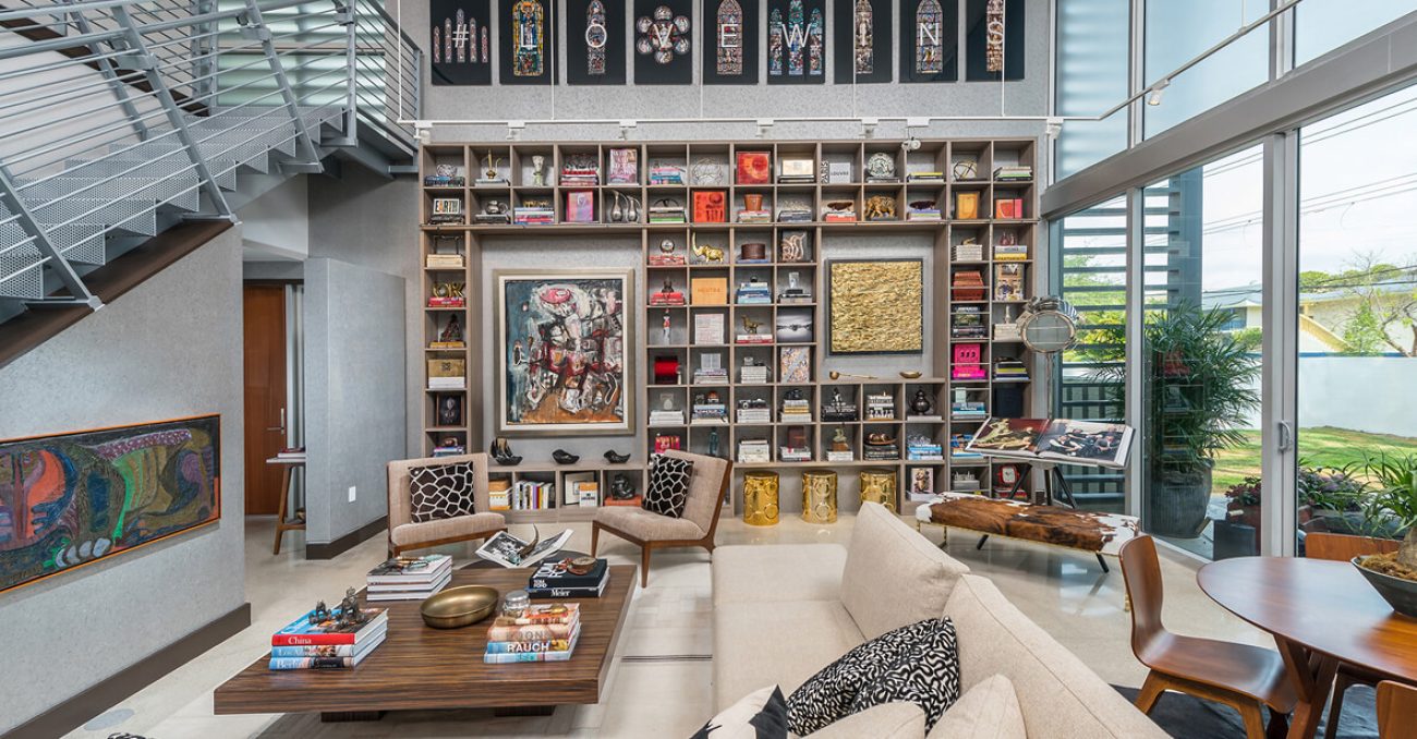 Modern wall-to-wall shelving with grid layout and integrated art display