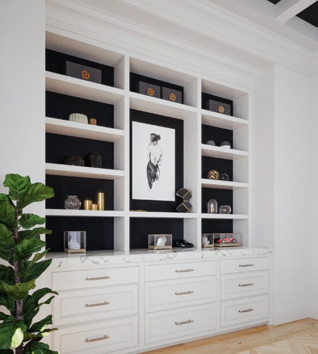 Contemporary built-in with white shelving and black backing and marble countertop