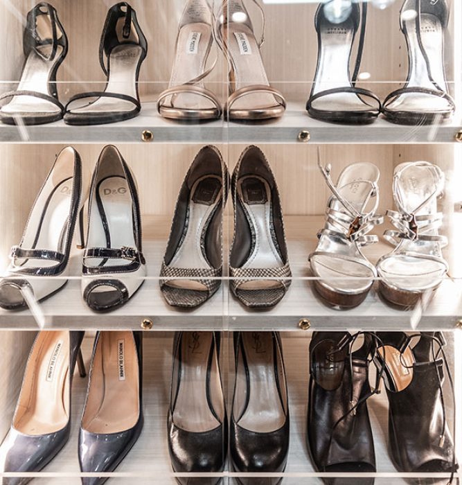 Slanted shoe shelves with Lucite toe catch