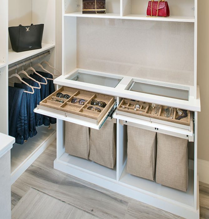 Suede trays for sunglasses and jewelry. Fabric hamper bags below.