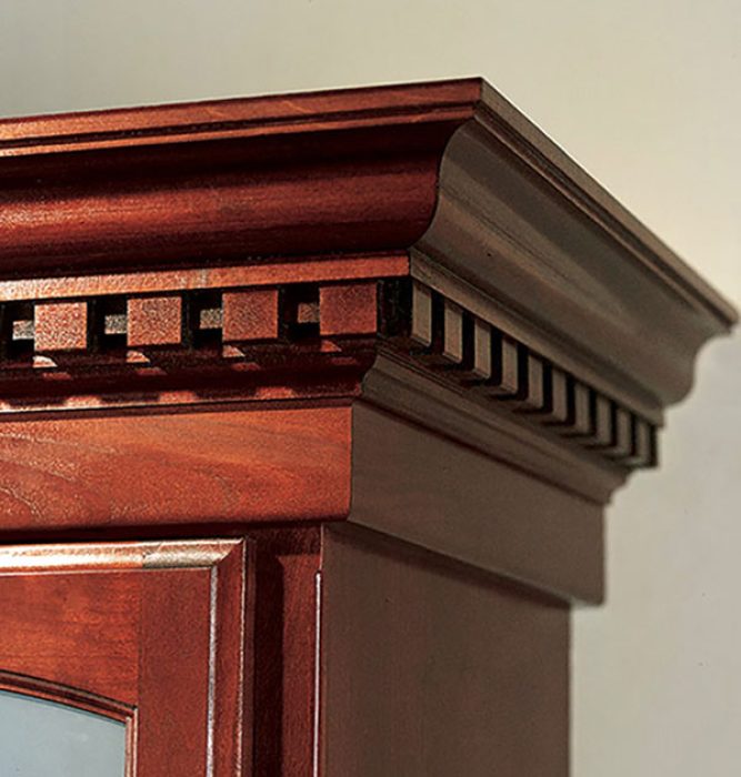 Dentil crown molding shown in cherrywood custom stained