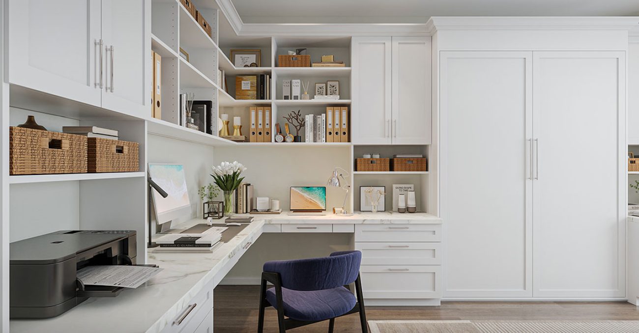 Home office with concealed built-in wall bed, wraparound desk, and open shelving.