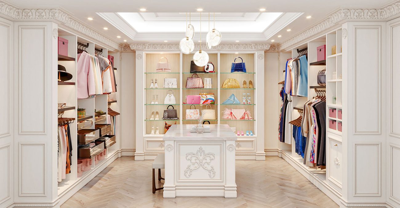 Custom walk-in solid wood system with open glass shelving, crown molding, and decorative appliques.